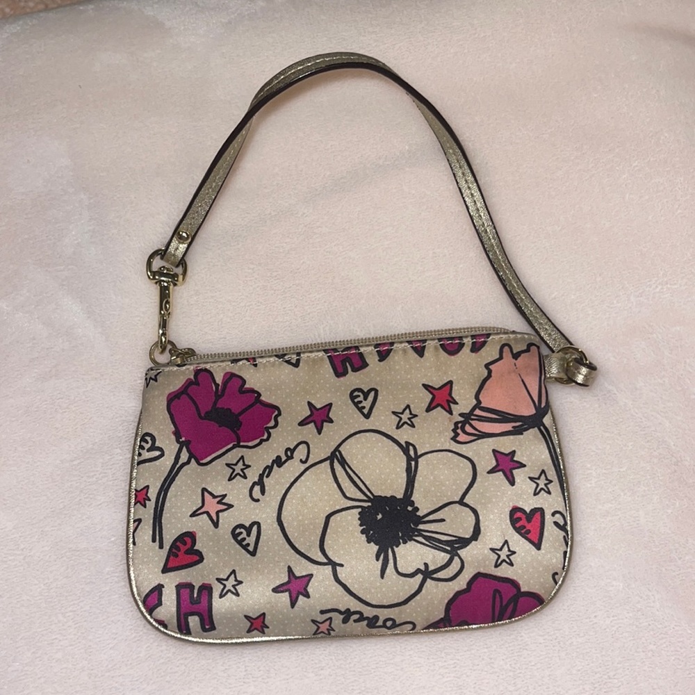 Coach floral “Poppy” wristlet purse